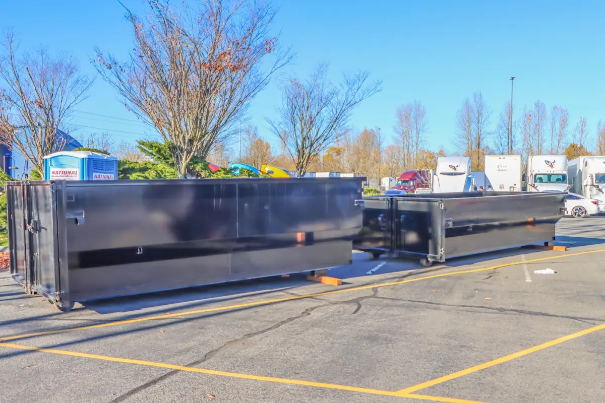 Professional dumpster rental service with roll-off container on residential driveway in Severance